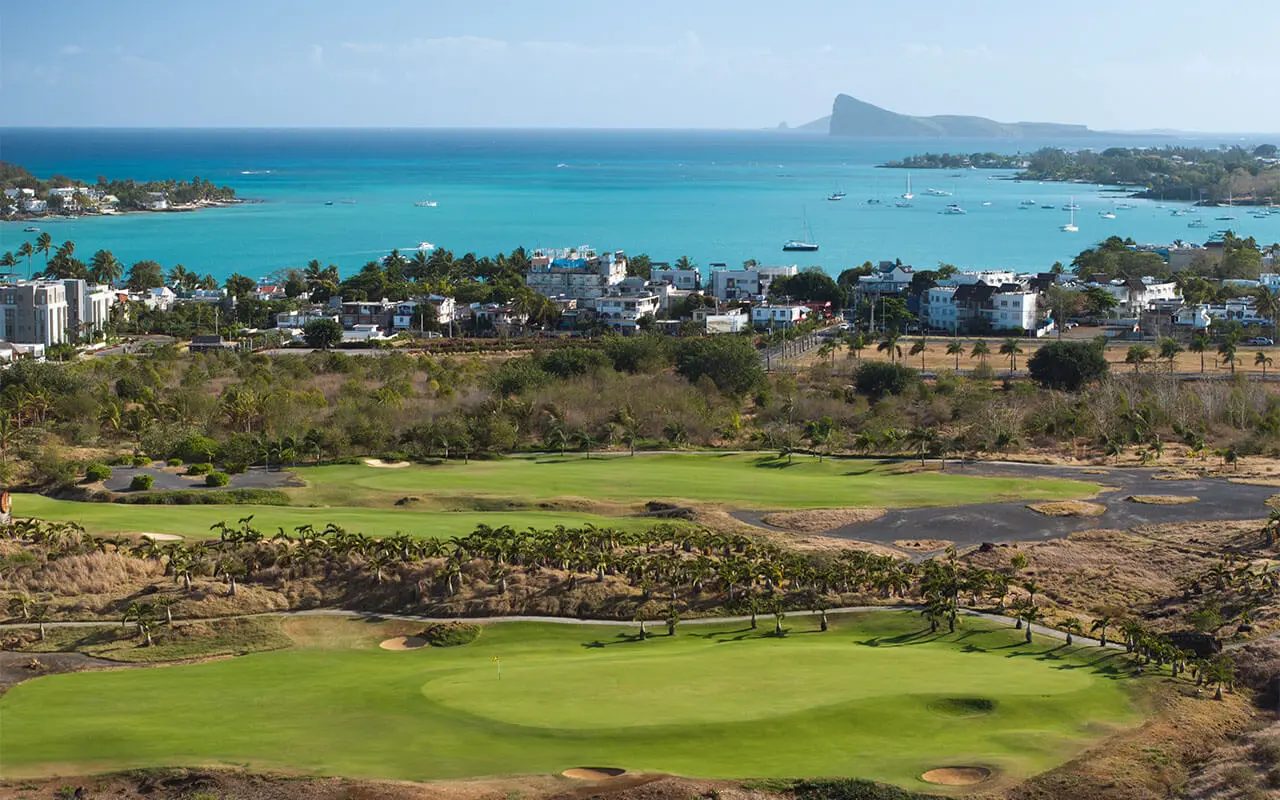 A green at Mont Choisy Le Golf above the turquoise bay of Grand Baie